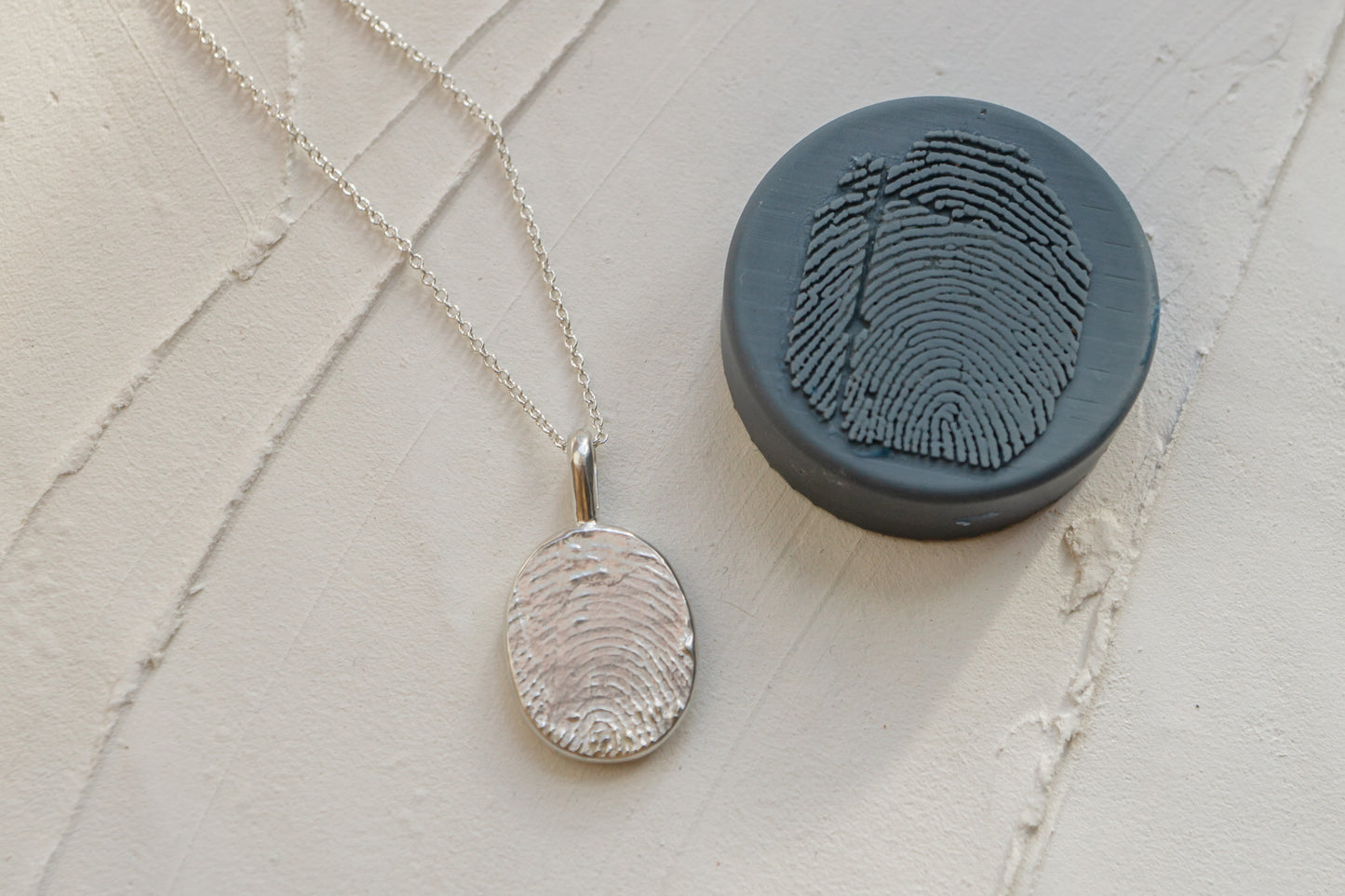 Fingerprint necklace from an ink imprint