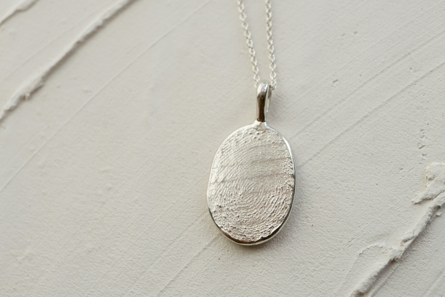 Fingerprint necklace from an ink imprint